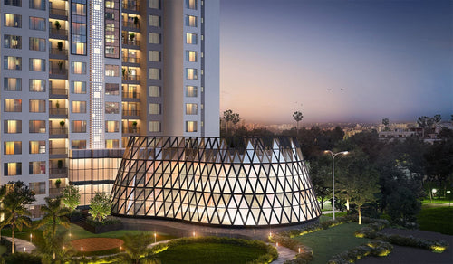 DLF PRIVANA SOUTH luxury residential tower with modern glass dome structure, set in landscaped greenery at dusk. Premium residential construction project.
