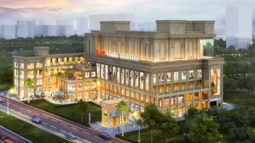 ELAN TOWN CENTRE retail complex with illuminated storefronts and modern architecture, ideal for business and industrial retail investments.