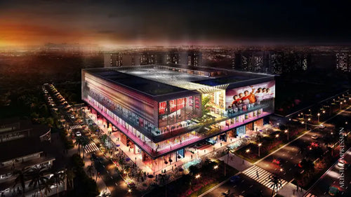ELAN EPIC commercial complex illuminated at night, showcasing vibrant LED advertising displays and modern architectural design in a cityscape setting.