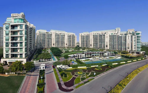 DLF THE MAGNOLIAS luxury residential towers with landscaped gardens and modern amenities in a premium real estate development.